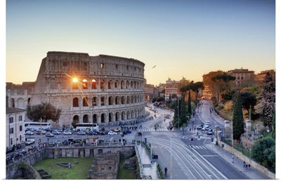 Italy, Rome, Colosseum and Roman Forum at sunset
