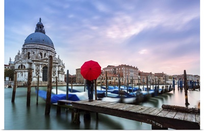 Italy, Veneto, Venice, woman standing with red umbrella