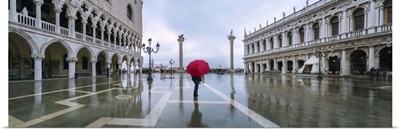 Italy, Veneto, Venice. Woman with red umbrella