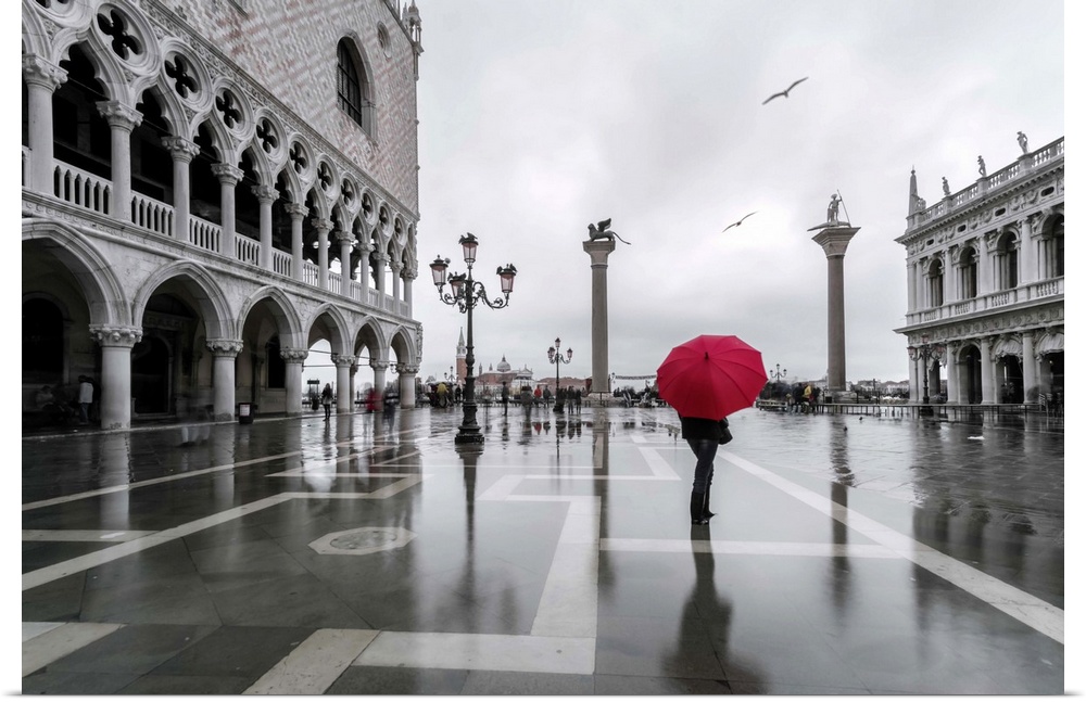 Italy, Veneto, Venice. Woman with red umbrella in front of Doges palace with acqua alta (MR)