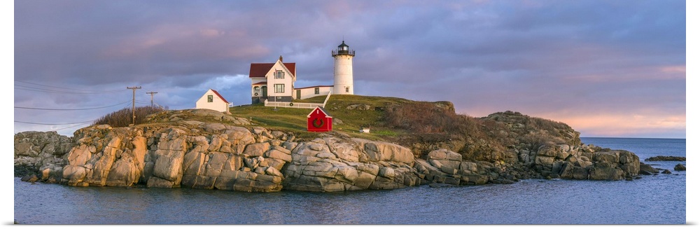 USA, Maine, York Beach, Nubble Light Lighthouse with Christmas decorations, dusk.