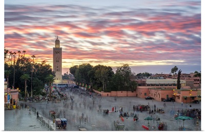 Minaret of Koutoubia Mosque and Jmaa El-Fna square at sunset
