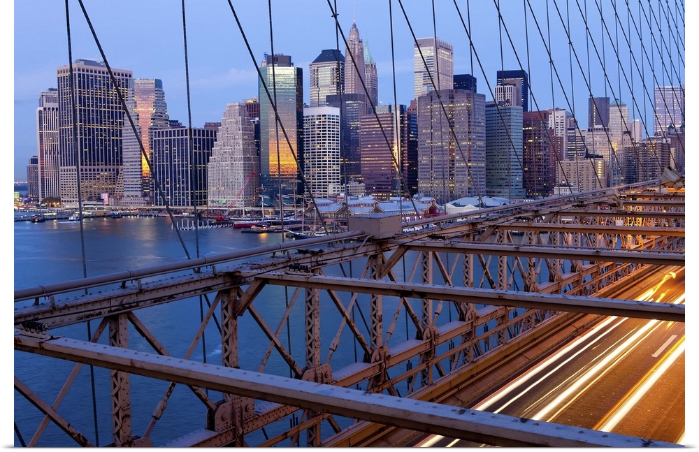 USA, New York City, Manhattan,  Downtown Financial District City Skyline viewed from the Brooklyn Bridge at dawn