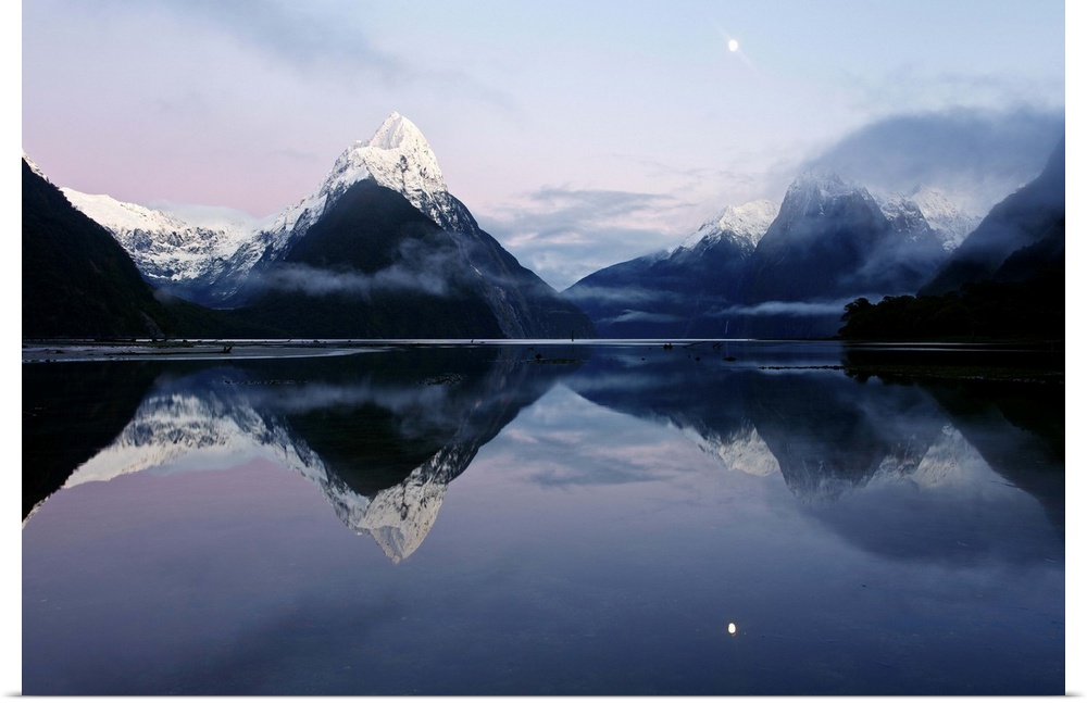 New Zealand, Nuova Zelanda, Fiordland, Milford Sound and moon during a cold and misty sunrise.