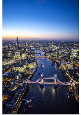 Night aerial view of The Shard, River Thames, Tower Bridge and City of London, England