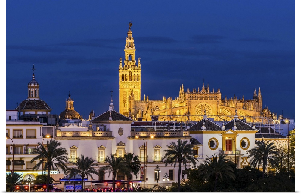 Night view of city skyline with Cathedral and Giralda bell tower, Seville, Andalusia, Spain.