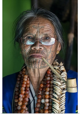 Old Lady With Glasses And Traditional Facial Tattoo Smoking A Pipe, Mindat, Myanmar