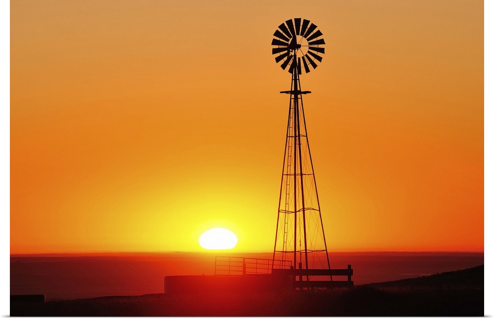 Old west windmill at sunset, Pawnee National Grassland, Colorado, USA