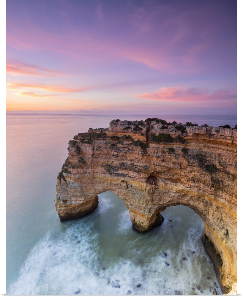 Panorama of cliffs framed by turquoise sea at dawn Praia da Marinha Caramujeira Lagoa Municipality Algarve Portugal Europe