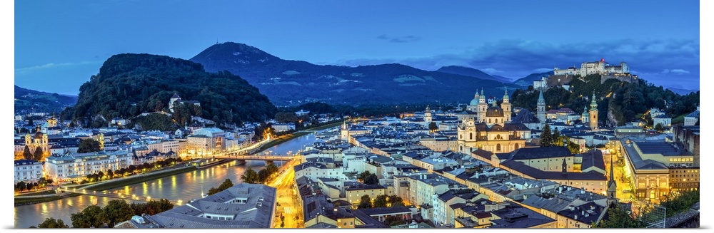Panoramic view over the old town and Hohensalzburg Castle at dusk, Salzburg, Austria