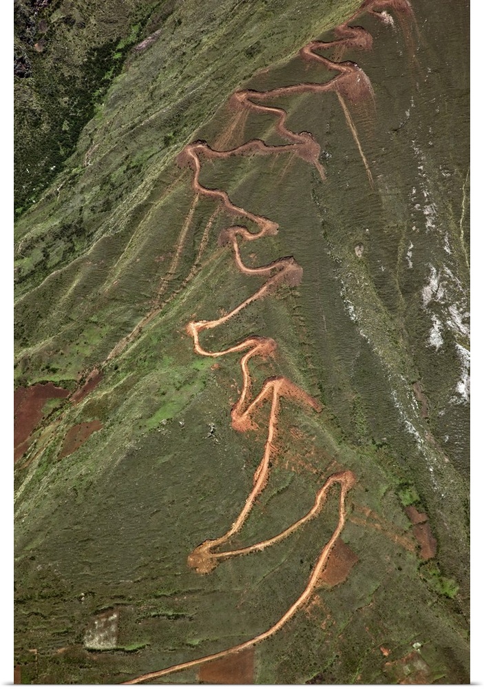 Peru. A trail zigzags up a steep ridge on the Andean Mountains east of Cusco.