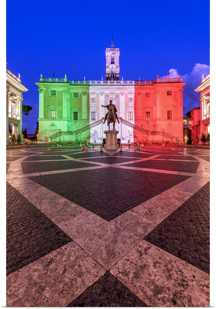 Piazza del Campidoglio with Palazzo Senatorio illuminated with the colors of the Italian flag, Rome, Lazio, Italy