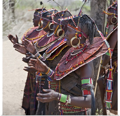 Pokot women wearing traditional beaded ornaments and brass earrings