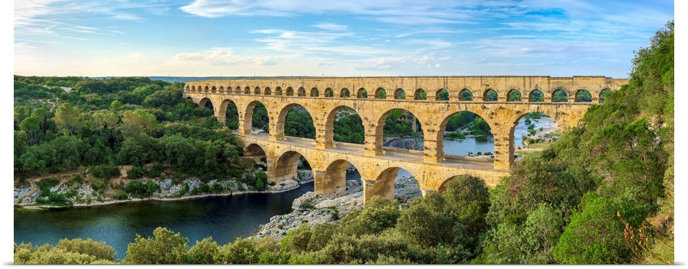 Pont du Gard Roman aqueduct over Gard River in late afternoon, Gard Department, Languedoc-Roussillon, France.