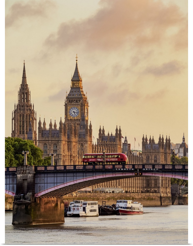 View over the River Thames towards the Palace of Westminster at sunrise, London, England, United Kingdom.