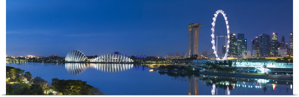 View of Singapore Flyer, Gardens by the Bay and Marina Bay Sands Hotel at dawn, Singapore.