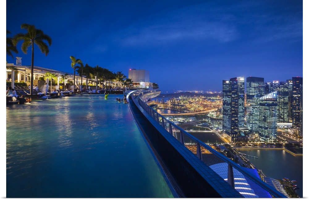 Singapore, Marina Bay Sands Hotel, rooftop swimming pool, dusk.