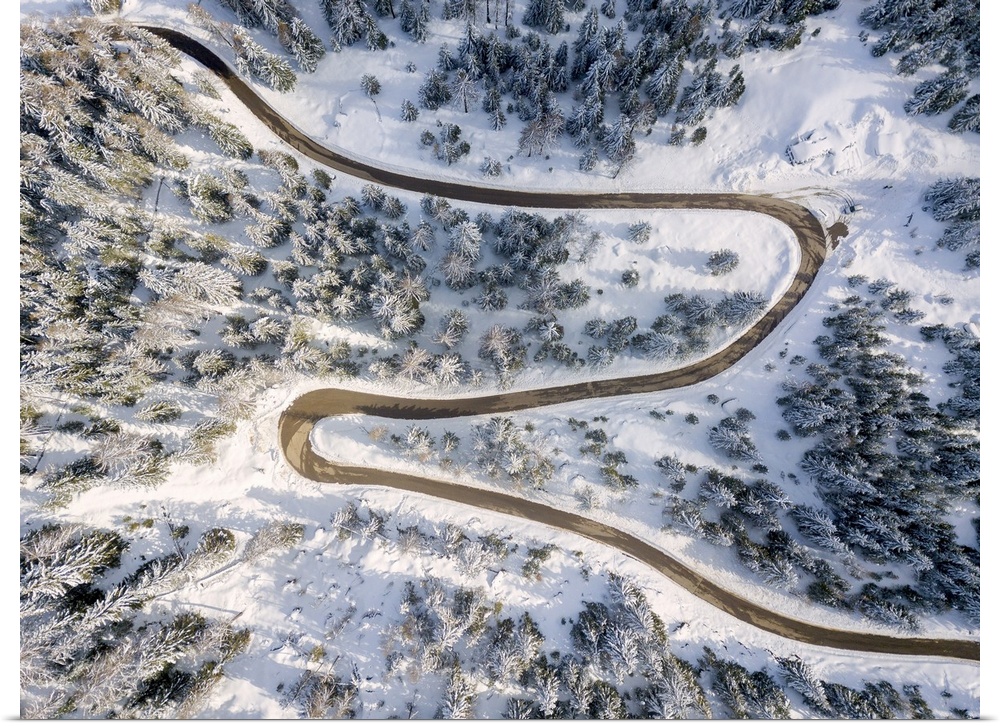 Snowy road aerial view, Passo Delle Erbe , Funes Valley, South Tyrol, Italy