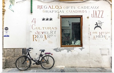 Spain, Andalusia, Cordoba. Bicycle against a wall in the old town