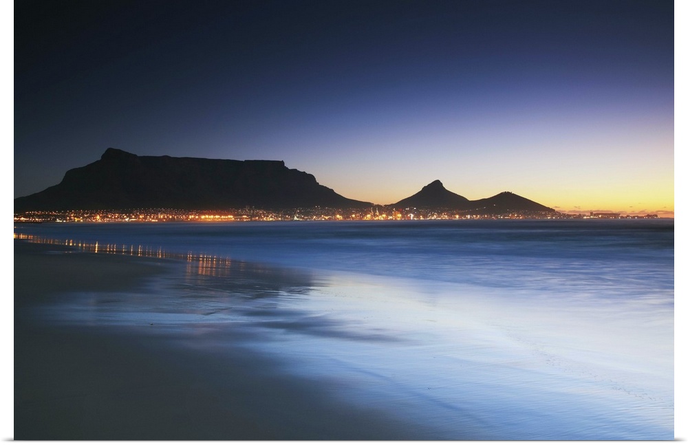 View of Table Mountain at dusk from Milnerton beach, Cape Town, Western Cape, South Africa