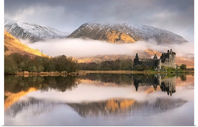 The abandoned ruin of Kilchurn Castle on a misty winter morning, Loch Awe, Scotland