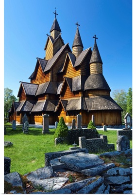 Tourists checking map beside Heddal Stave Church, Norway