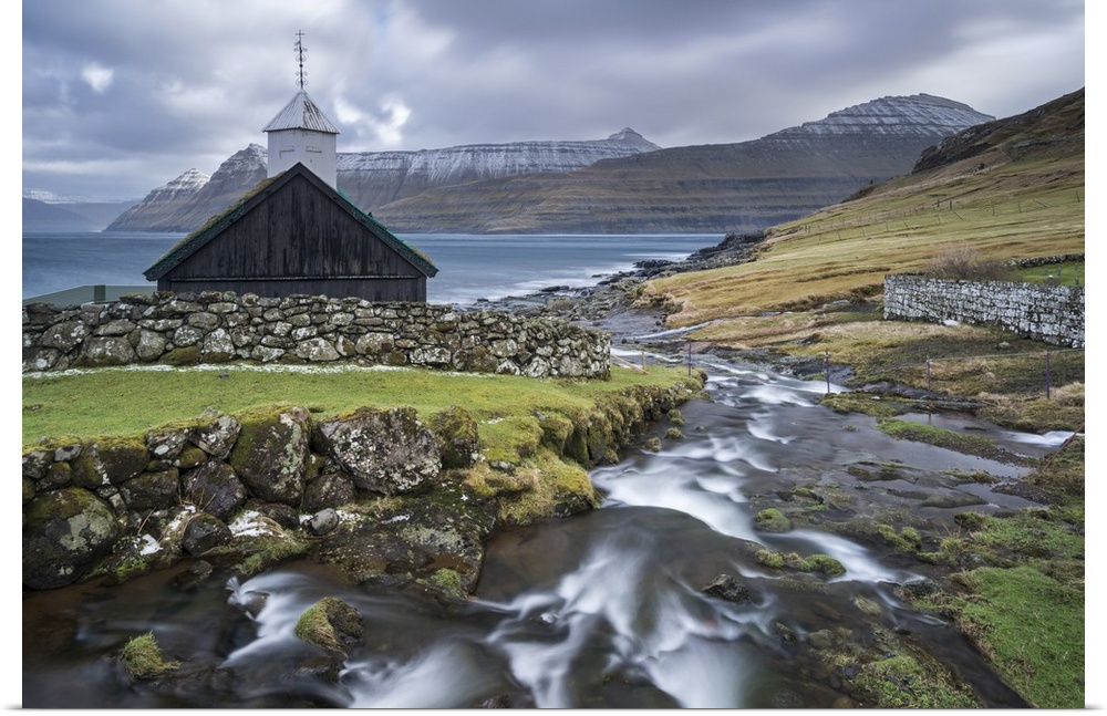 Traditional Faroese wooden turf roofed church in the village of Funningur on the island of Eysturoy, Faroe Islands, Denmar...