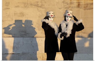 Two Women Pose In Costumes During The Venice Carnival, Italy