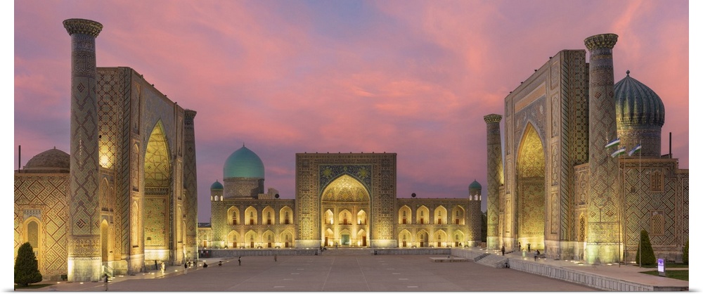 Uzbekistan, Samarkand, Registan square illuminated at sunset.
