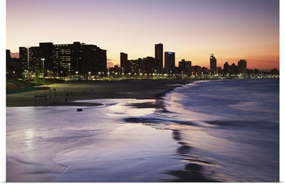 View of city skyline and beachfront at sunset, Durban, KwaZulu-Natal, South Africa