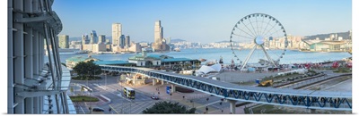 View of Star Ferry pier, observation wheel and Tsim Sha Tsui skyline, Hong Kong, China