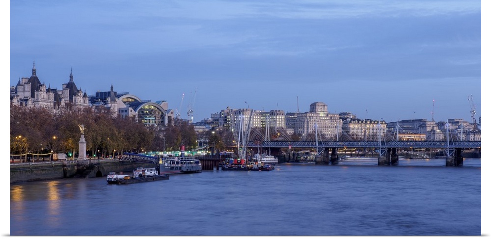 View over River Thames towards Hungerford Bridge and Charing Cross Station, London, England, United Kingdom