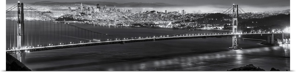 Golden Gate Bridge with Bay Bridge Illuminated in Background