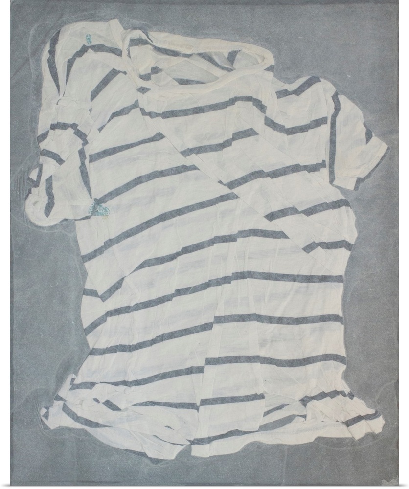 A striped, torn and mended t-shirt suspended in handmade paper.