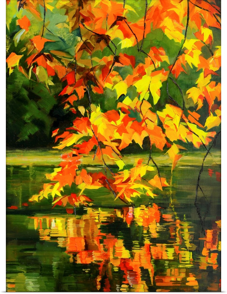 Leaves in fall haning over water.