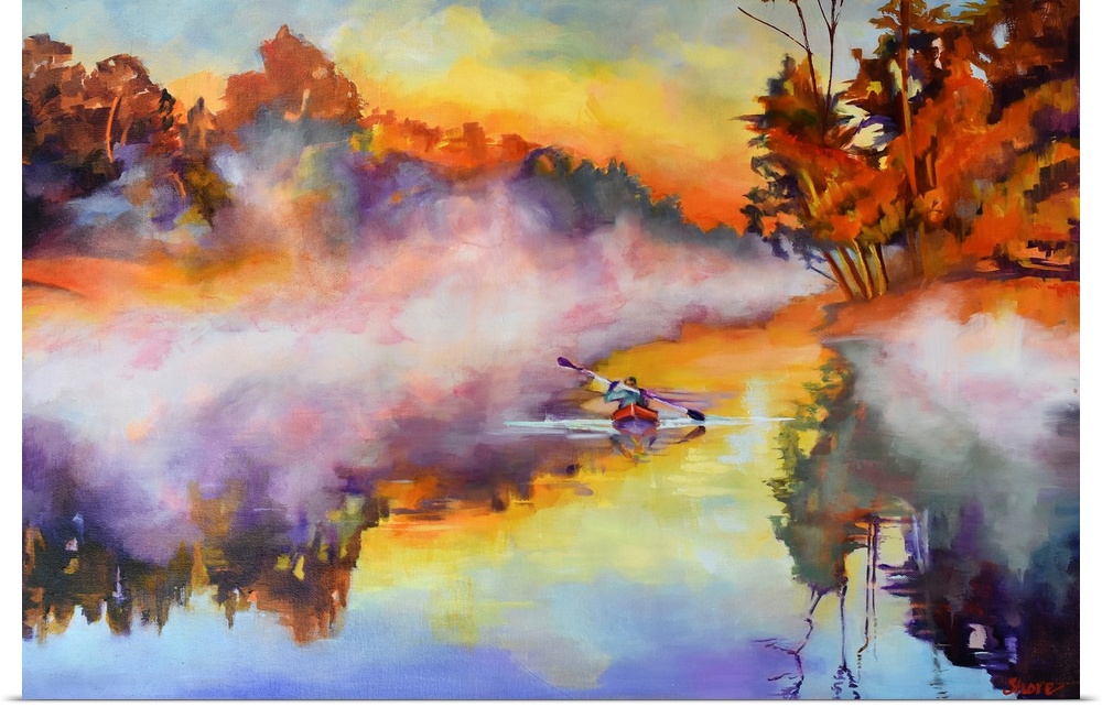Kayaker on a lake on a misty morning.