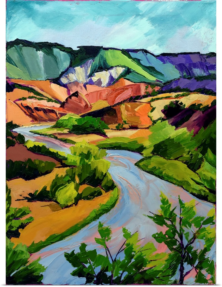 Scene in New Mexico of mountains, river, and valley in vivid colors.