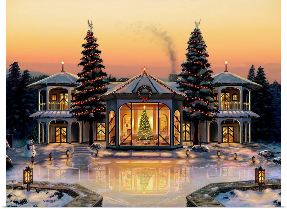 Under an orange and gold winter sunset a lavish dream home waits decorated for the season.