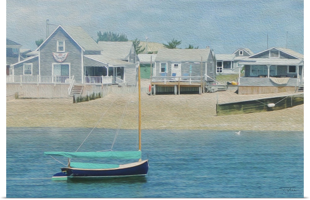 Beach houses with wooden piers near the ocean with a small boat on the water.