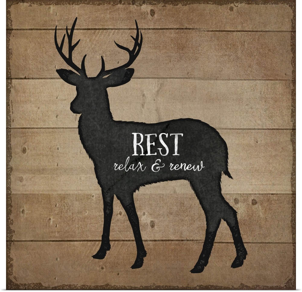 Cabin decor of a deer silhouette on a wooden board background.