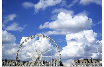 A ferris wheel in Paris, France, on a cloudy day