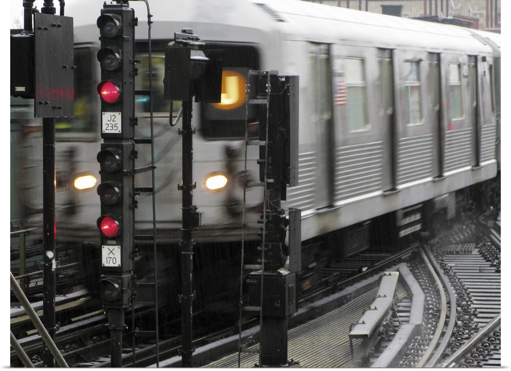 Photograph taken of a subway train while it is in motion.