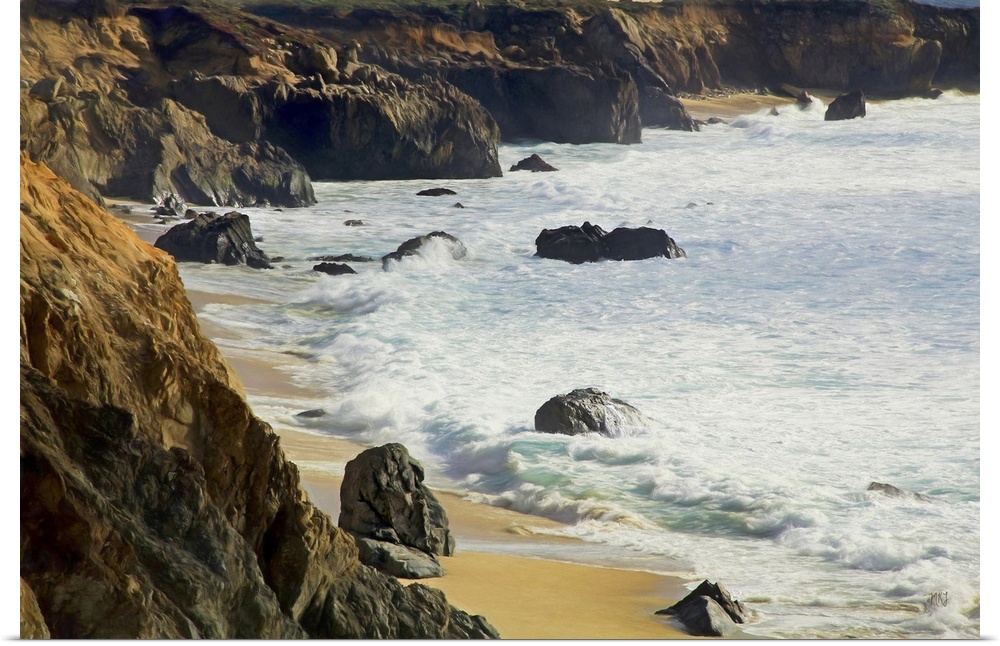 Gentle waves reach the bluffs at Garrapata Beach in Big Sur, their cool colors complementing the warm tones of the beach, ...