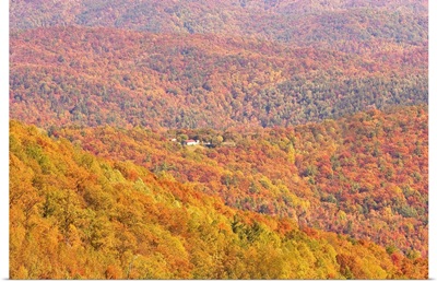 A home surrounded by colorful fall forests on the Blue Ridge Parkway