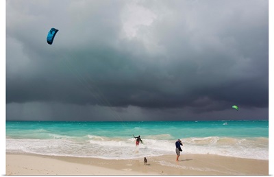 A kiteboarder enjoying gusty winds created by Hurricane Tomas