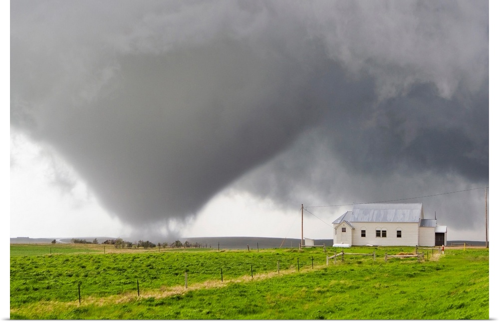 A powerful tornado approaches a church and just misses hitting it.