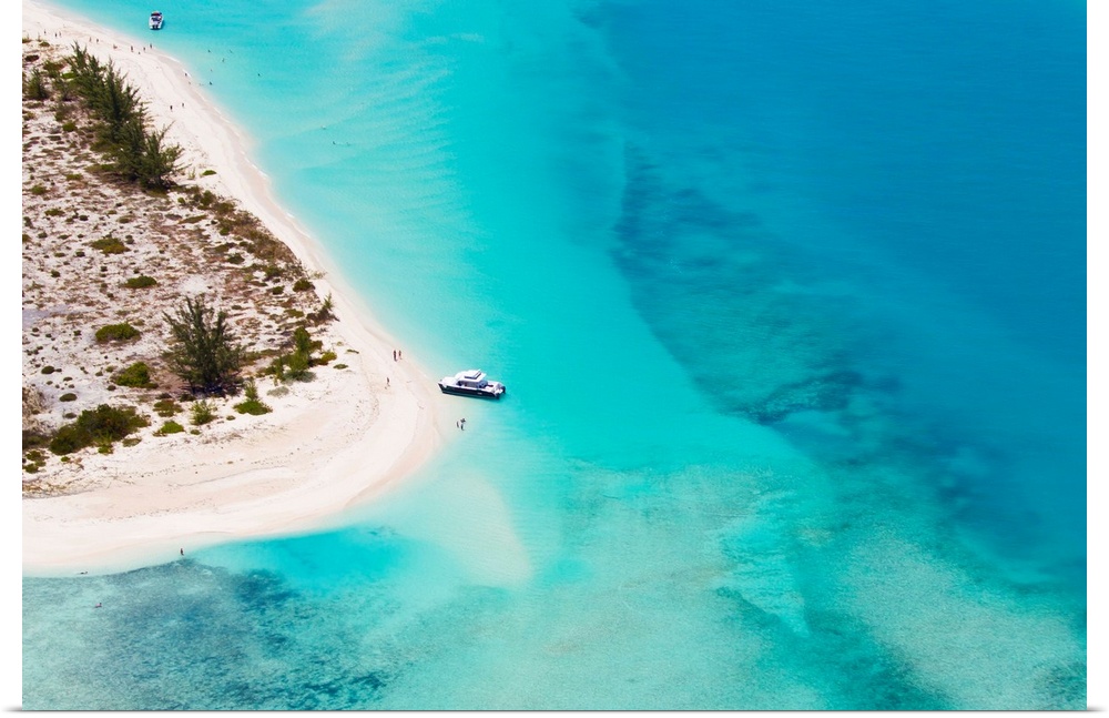 An aerial view of boat pulled ashore on a private island in the Turks and Caicos.