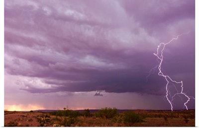 Intense purple lightning bolts strike in the desert of New Mexico