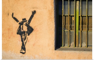 Michael Jackson stenciled on a wall near a window