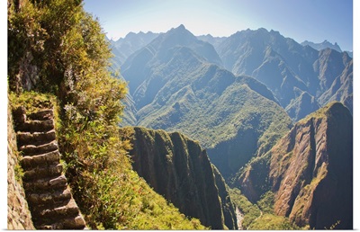 Steep stairs on a mountain side on the Inca trail at Machu Picchu